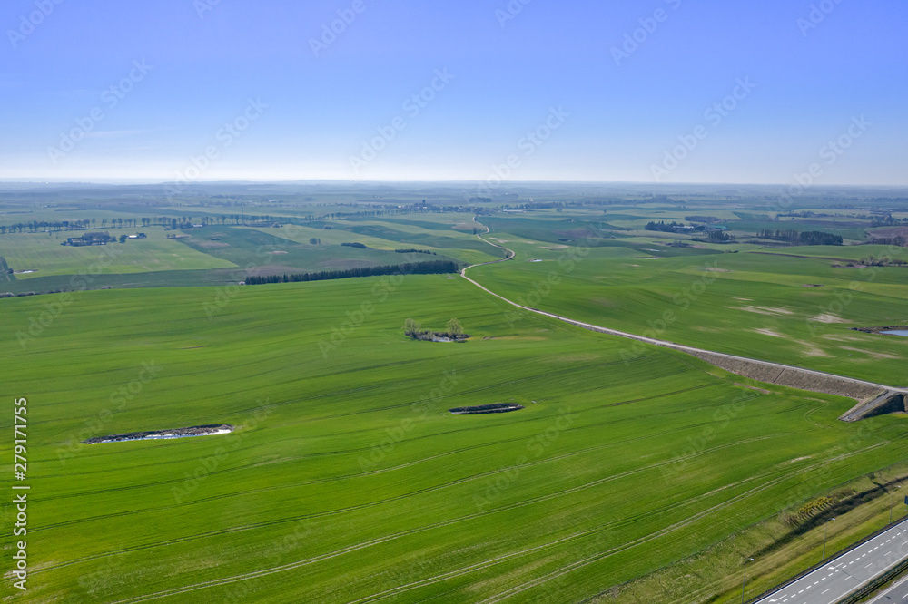 Beautiful aerial view landscape with green meadow stretching to the horizon. 