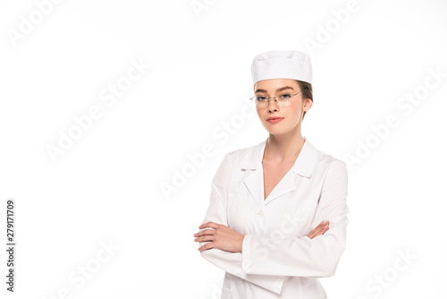 young doctor in white coat with crossed arms isolated on white