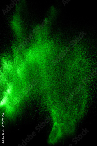 Green particles explosion on black background. Color dust splash use for abstract background. © Pattadis