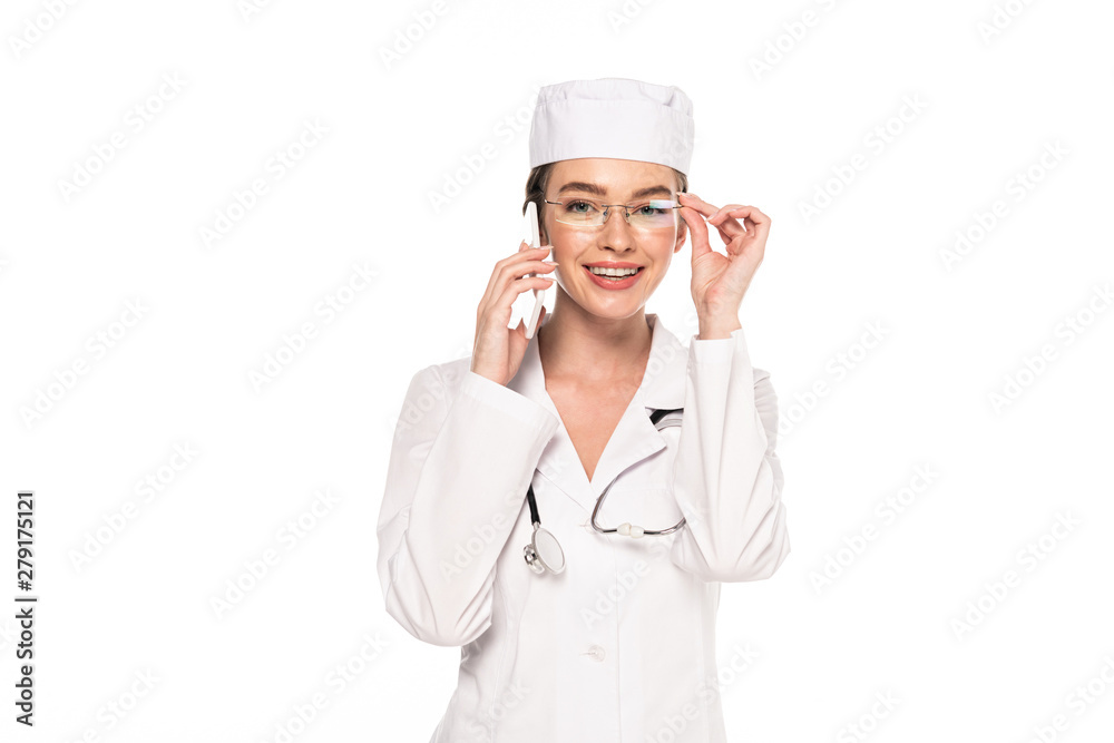 young smiling doctor in white coat talking on smartphone isolated on white young smiling doctor in white coat talking on smartphone isolated on white