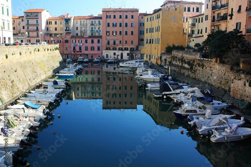 Boats in the canal of the city of Livorno, Italy