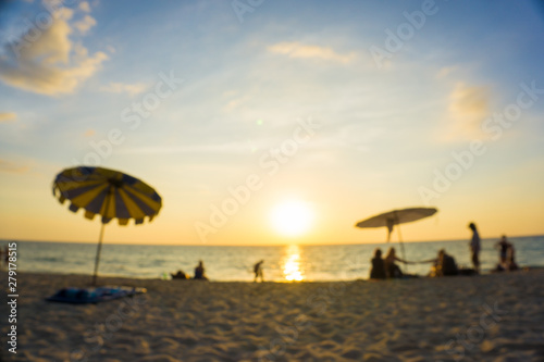 Blurred group of people enjoying sunset on sea beach © themorningglory