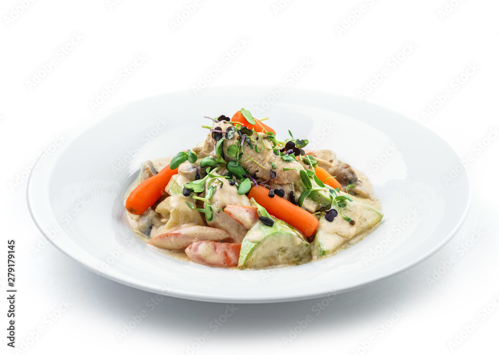 Hot salad with chicken meat, carrots, mushrooms, zucchini and cheese sauce isolated on white background. Healthy food, top view Hot salad with chicken meat, carrots, mushrooms, zucchini and cheese sauce isolated on white background. Healthy food, top view