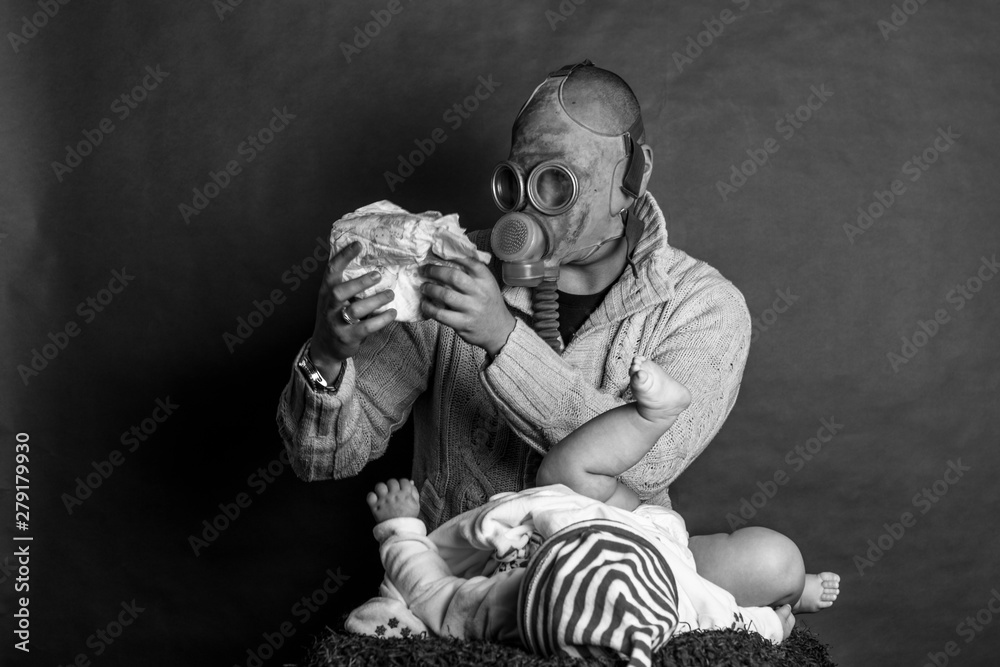 Young Dad cleaning his baby's dirty ass, changing the stinky diaper in