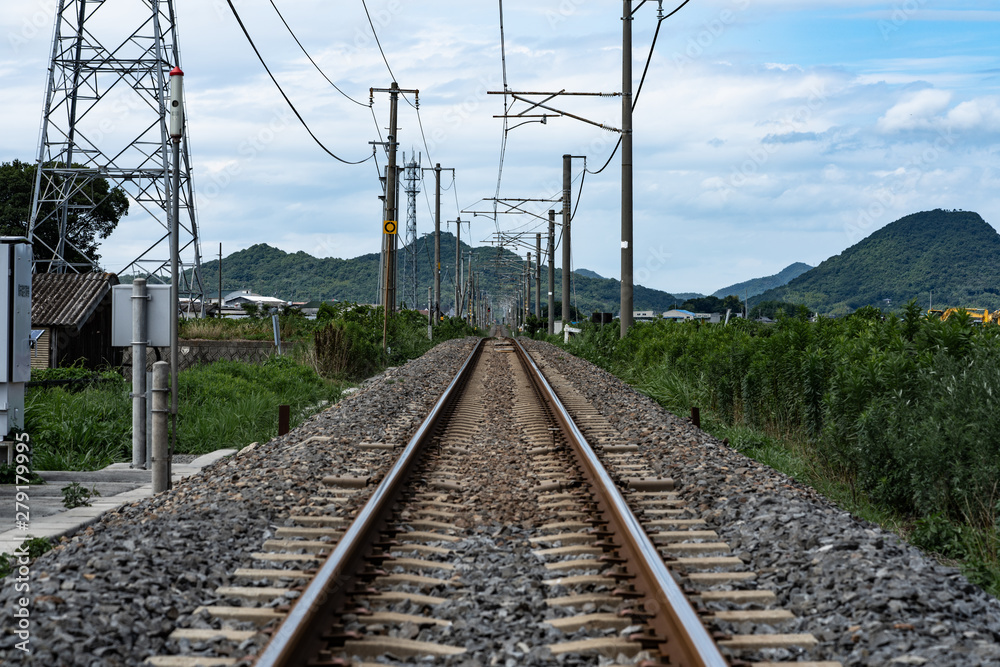 straight rail way in rural area in Japan