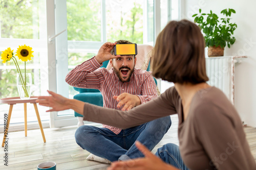 Fotografie Couple playing a word game