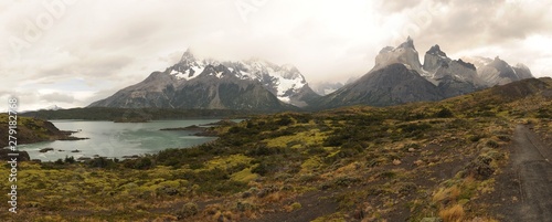 Lake and stunning Cuernos del Paine in Patagonia. Torres del Paine National Park, Patagonia, Chile the mountain scenery under the cloudy and blue dramatic sky. Travelling.