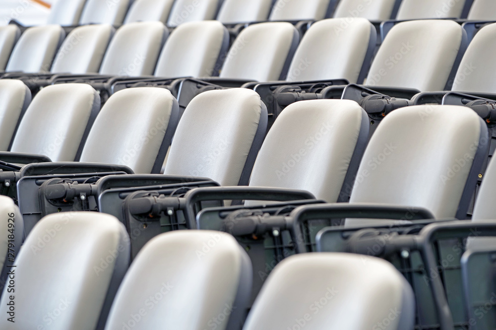 Empty stands with seats in the stadium Empty stands with seats in the stadium