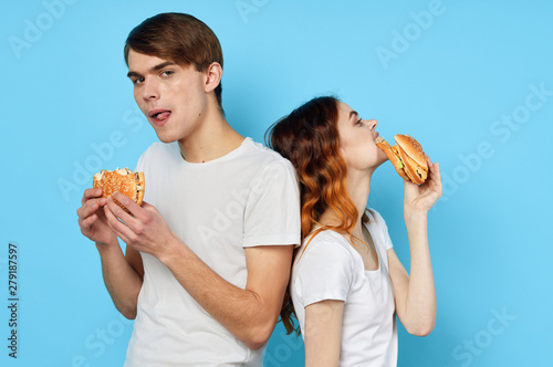 man and woman with hamburger