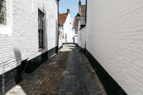 A white brick town built in the seventeenth century. St Elisabeth Beguinage of Kortrijk. Courtrai, Belgium photo