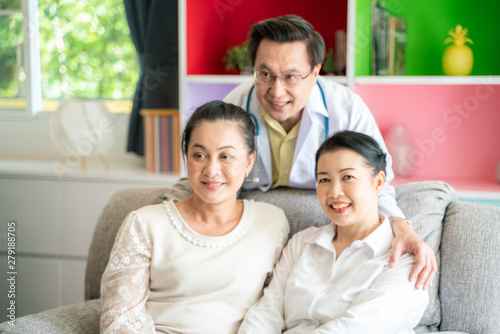 Happy medical doctor consultant with middle age women © themorningglory