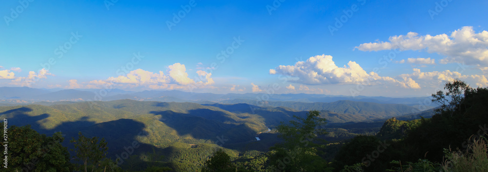 Morning landscape of fog mountains and blue sky panorama