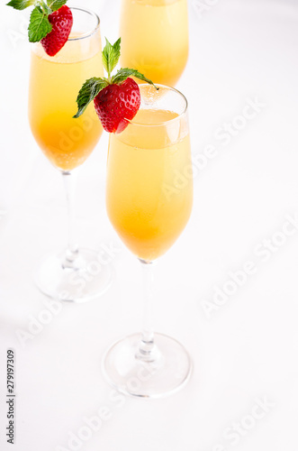 Glasses of wine and champagne with strawberry iIsolated on white background, close up. Party and holiday celebration. The buffet at the reception.
