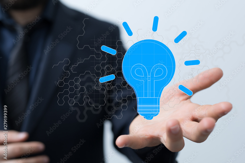  holding illuminated light bulb, idea, innovation and inspiration concept.
