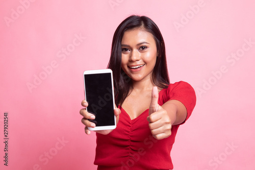 Young Asian woman show thumb up with mobile phone.