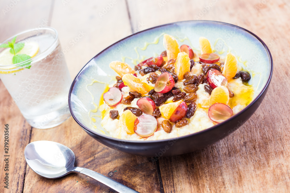 Tasty breakfast idea - porridge with fresh fruit and honey Tasty breakfast idea - porridge with fresh fruit and honey
