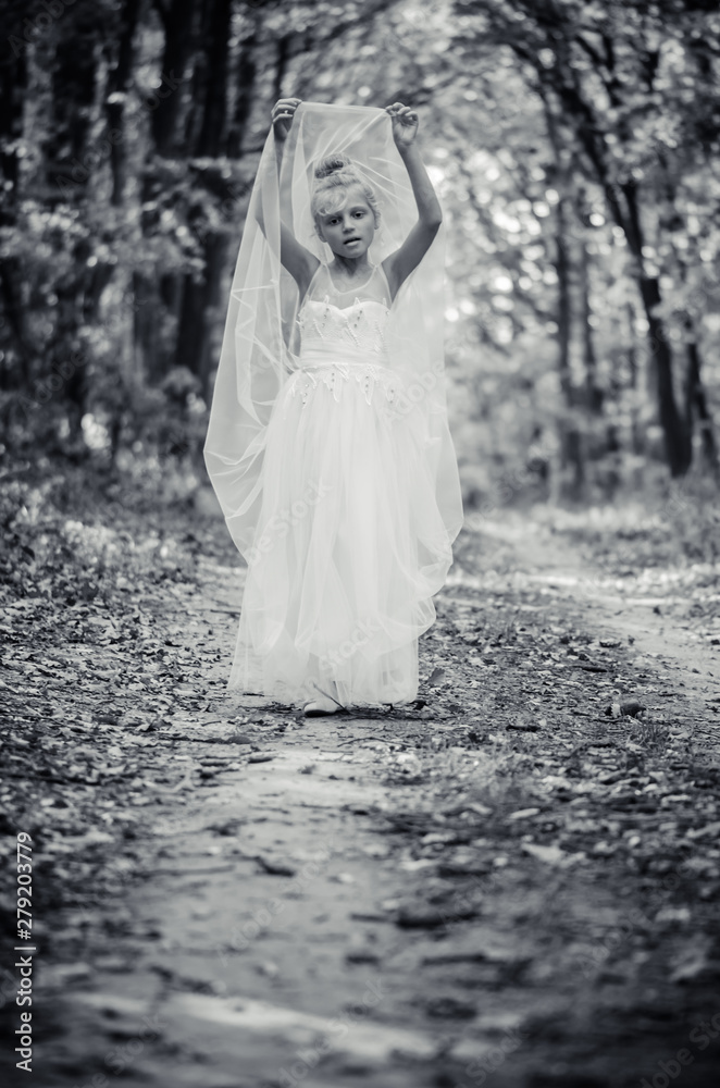 adorable child in long white wedding dress adorable child in long white wedding dress