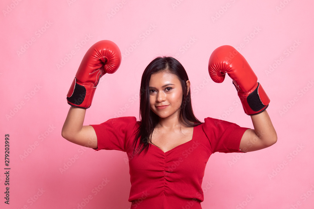 Young Asian woman with red boxing gloves.