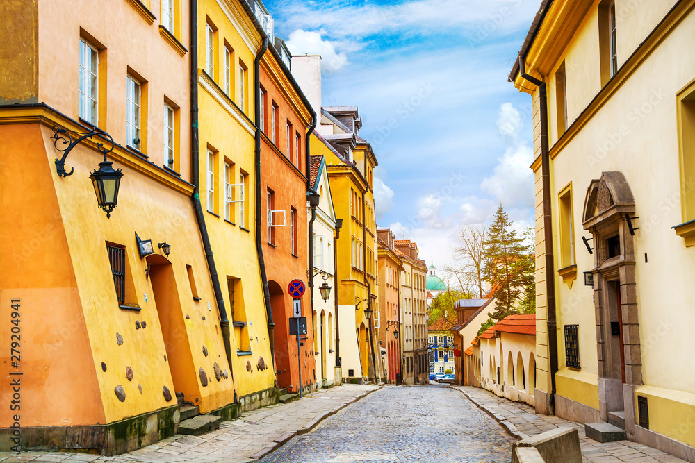 Street with colorful houses in Old Town of Warsaw, capital of Poland.