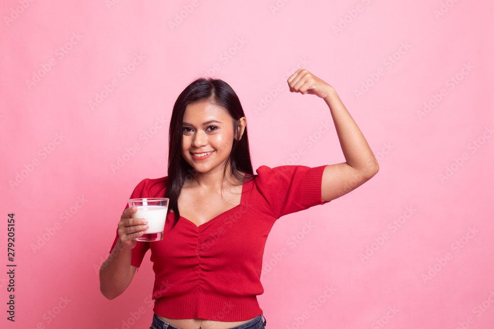 Healthy Asian woman drinking a glass of milk. Healthy Asian woman drinking a glass of milk.