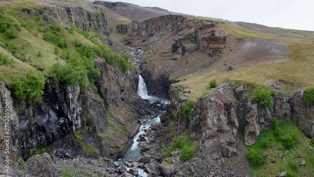 Litlanesfoss waterfall on rainy, cloudy day, Iceland. Litlanesfoss waterfall on rainy, cloudy day, Iceland.