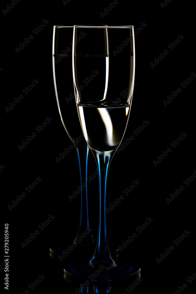 Elegant picture of glasses with clear water on a black background