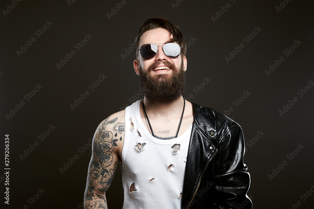 Obraz premium smiling man. bearded Sexy boy in leather coat