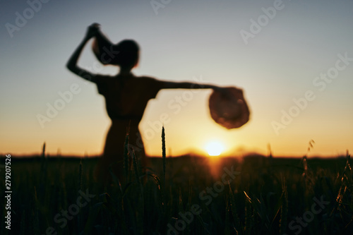 silhouette of woman in the field