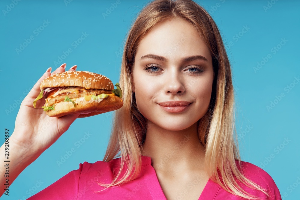 young woman with hamburger