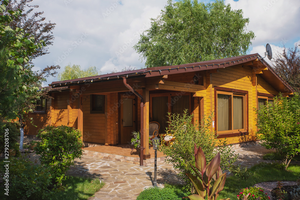 Country cottages with log and timber in the green area. cozy eco ...
