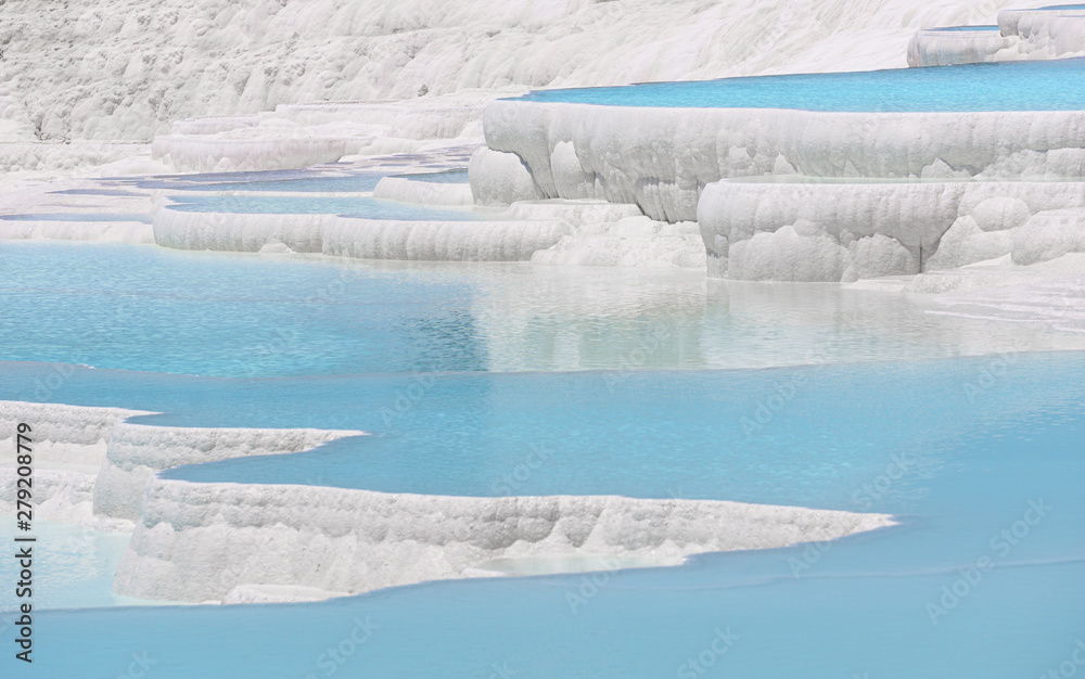 Blue travertine pools and terraces in Pamukkale, Denizli, Turkey. Cotton castle. Blue travertine pools and terraces in Pamukkale, Denizli, Turkey. Cotton castle.