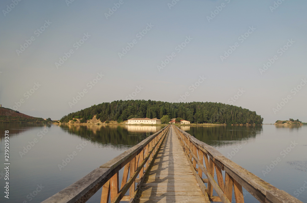 Wooden pedestrian bridge to island Zvernec inside Narta Lagoon. On island there is St. Mary's Monastery, also known as Monastery of Dormition of Theotokos Mary, is medieval Byzantine church. Albania
