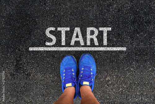 Start. man with a shoes is standing next to line and word START