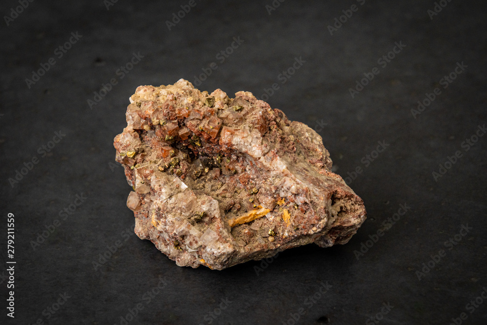 Fools gold yellow gemstone containing fragments of gold alike mineral Fools gold yellow gemstone containing fragments of gold alike mineral