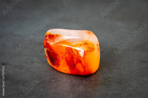 Chinese carnelian gemstone with smooth surface white orange and deep rep tones photo