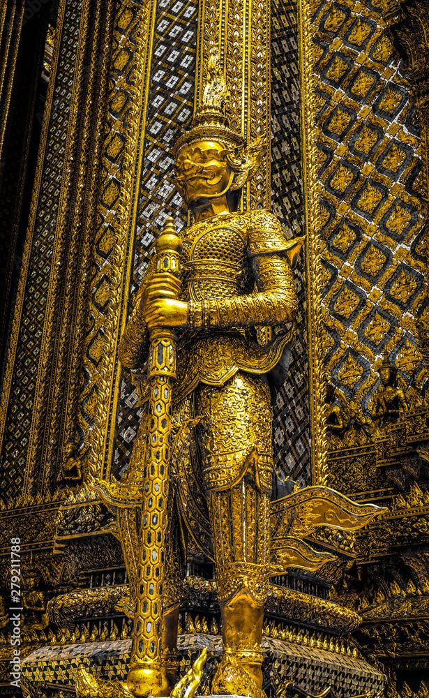 Fototapeta premium Beautiful close up color black white and gold Wat Phra Kaew or Temple of Emerald Buddha, Guardian statues pagoda and Grand palace located within the grounds of the Grand Palace in Bangkok