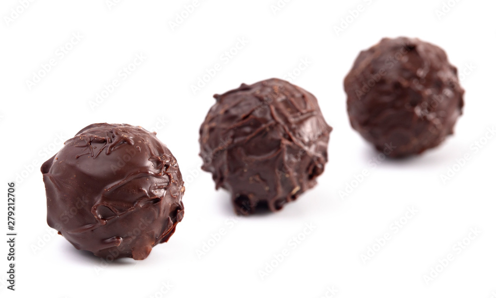 Dark Chocolate Truffles Filled with Caramel on a White Backgroun Dark Chocolate Truffles Filled with Caramel on a White Backgroun