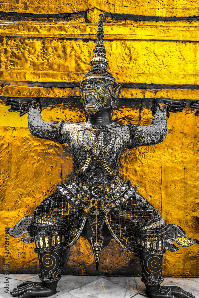 Beautiful close up color black white and gold Wat Phra Kaew or Temple of Emerald Buddha, Guardian statues pagoda and Grand palace located within the grounds of the Grand Palace in Bangkok