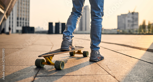 Young guy with longboard photo