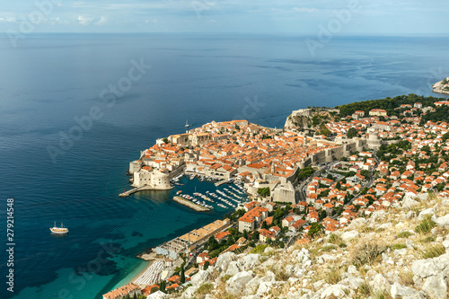 Beautiful townscape of Dubrovnik city in Croatia, panorama view. Old town and blue bay with boats