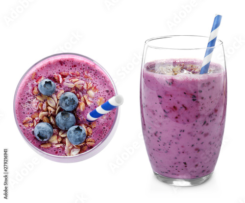 Glasses of delicious blueberry smoothie on white background