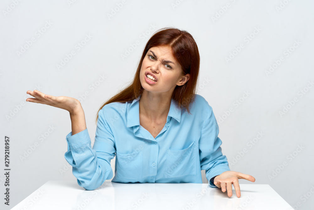 smiling young woman pointing at copy space smiling young woman pointing at copy space