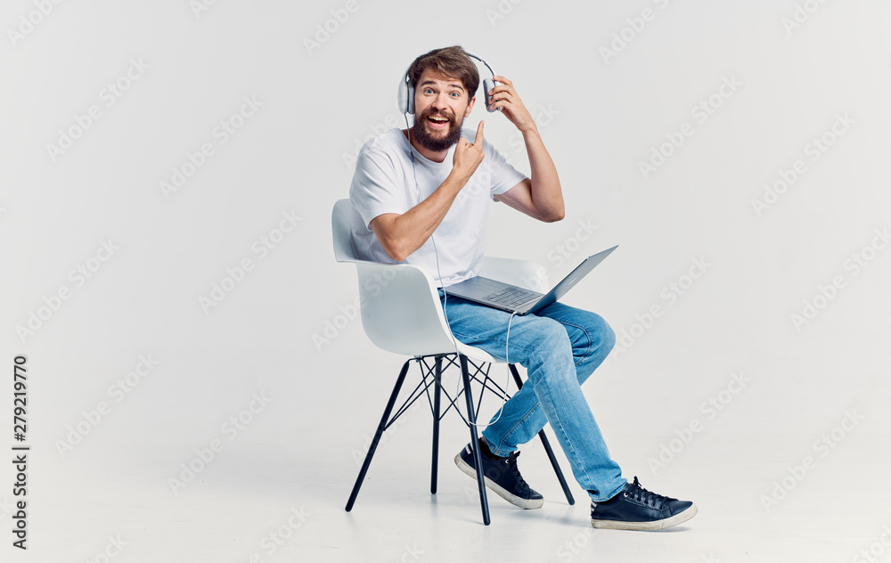 young woman sitting on a chair isolated on white background young woman sitting on a chair isolated on white background