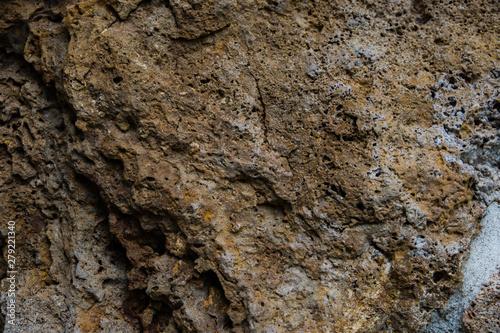 Background of old stone. Limestone is a sedimentary, detrital rock of organic, less often chemogenic origin, consisting of calcium carbonate (CaCO3) in the form of calcite crystals.