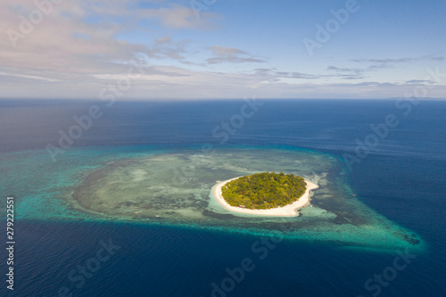 Mantigue Island, Philippines. Tropical island with white sandy beach and coral reefs. Seascape, view from above.