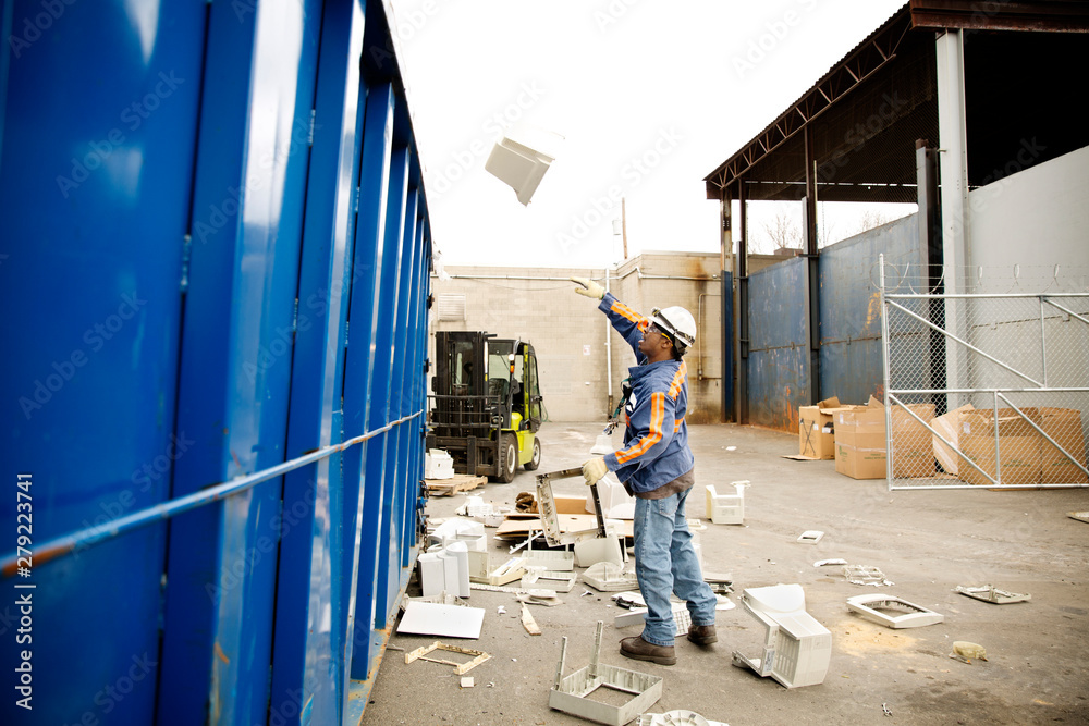 Fototapeta premium Industrial worker recycling computer parts