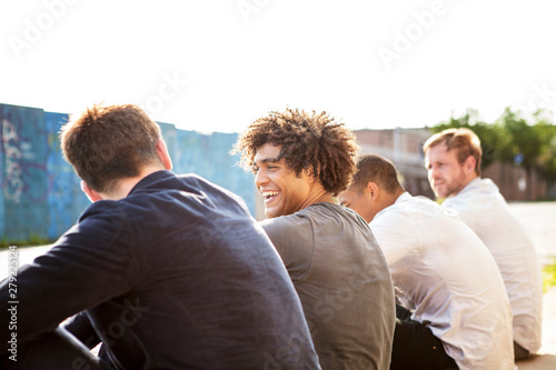 Four friends sitting and talking