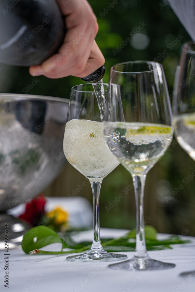 Close up of pouring in aperitif at an outdoor bar Close up of pouring in aperitif at an outdoor bar