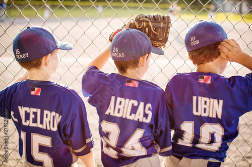 Photography Rear view of baseball players looking at field