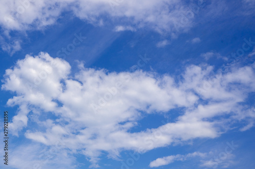 Blue sky in the soft white clouds. Natural cloudscape background  texture. Wide Horizontal Wallpaper With Copy Space
